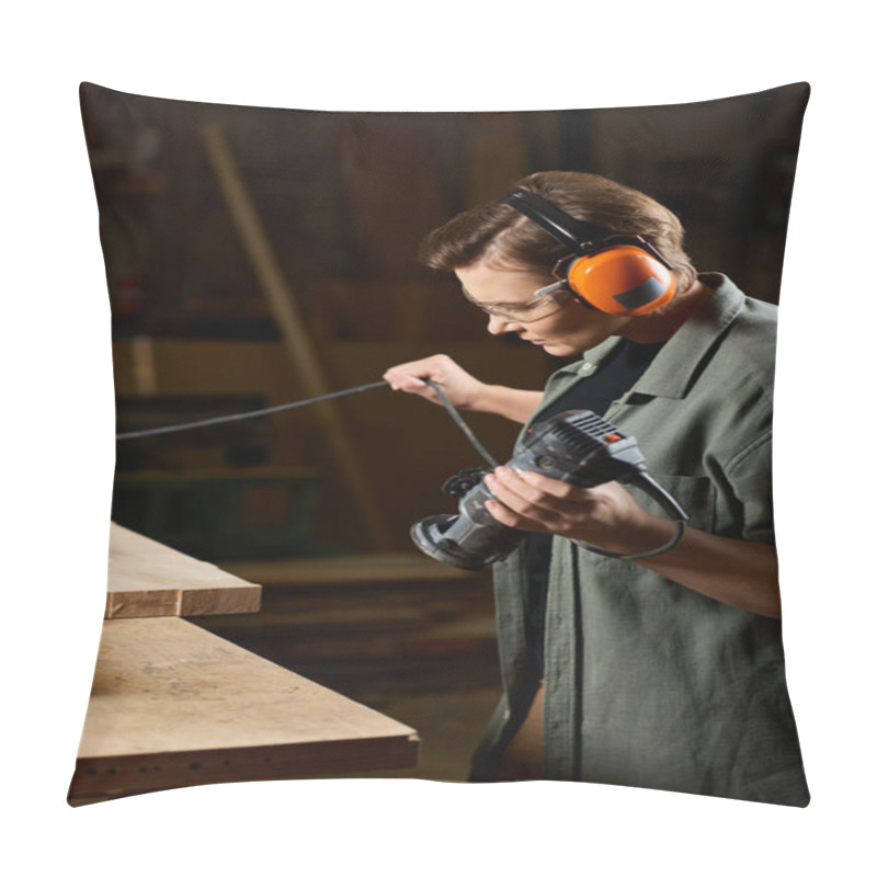 Personality  A Dedicated Carpenter Expertly Uses A Power Tool While Shaping Wood In Her Workshop, Highlighting Her Craftsmanship. Pillow Covers