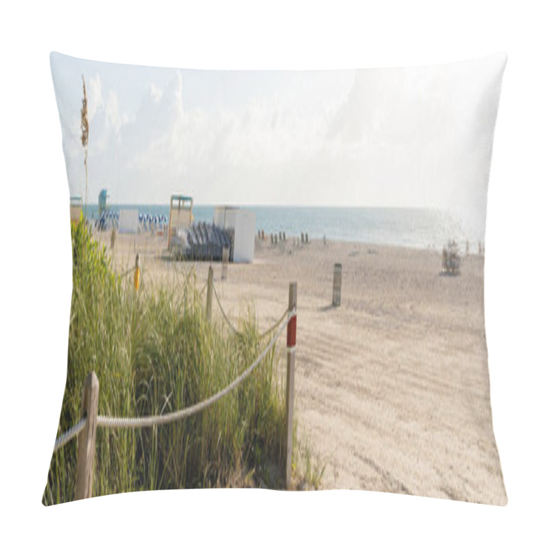 Personality  A Serene Sandy Beach Lined With A Fence And Tall Grass, Under A Bright Sky, Offering A Peaceful Escape In Nature. Pillow Covers