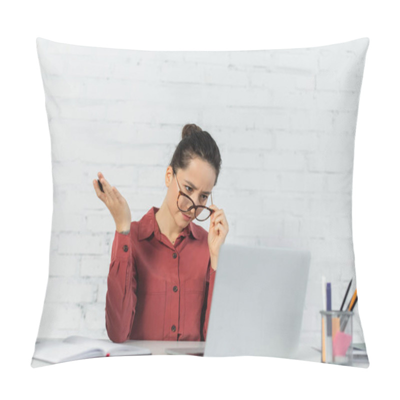 Personality  Teacher Adjusting Eyeglasses While Looking At Laptop And Holding Pen Pillow Covers