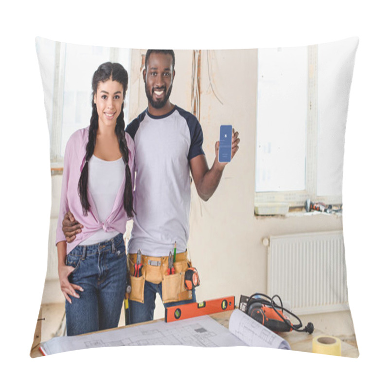 Personality  Couple Holding Smartphone With Facebook App On Screen During Renovation Pillow Covers