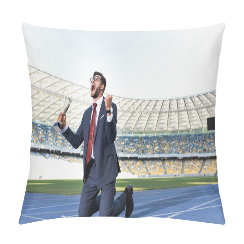 Personality  Young Businessman In Suit Standing On Knees On Running Track With Trophy And Scream At Stadium Pillow Covers