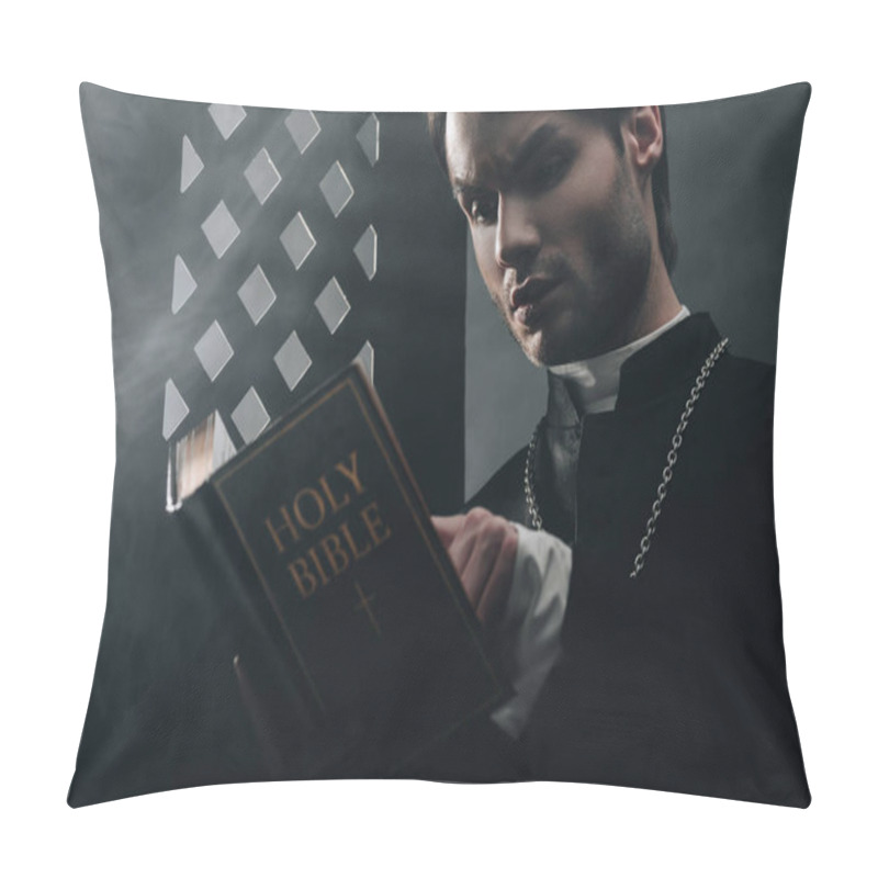 Personality  Young Thoughtful Catholic Priest Reading Bible Near Confessional Grille In Dark With Rays Of Light  Pillow Covers