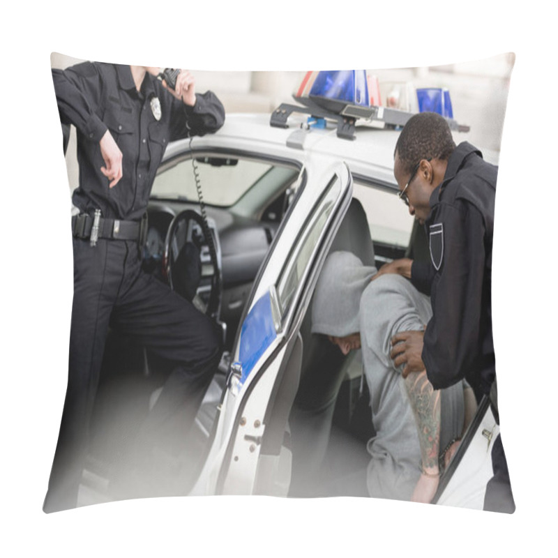 Personality  Cropped Shot Of Policewoman Talking On Radio Set While Her Partner Placing Arrested Man In Car Pillow Covers