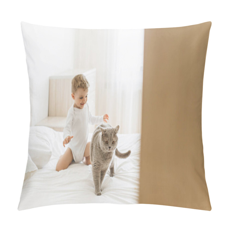 Personality  happy little child playing with grey british shorthair on bed at home pillow covers