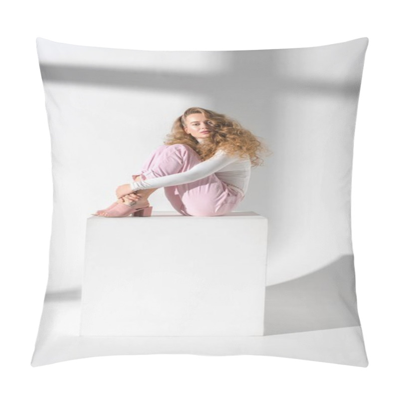 Personality  Beautiful Serious Woman With Curly Hair Sitting On White Cube And Hugging Legs Pillow Covers