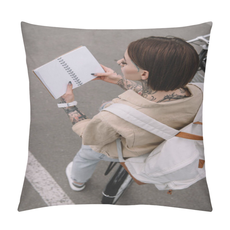 Personality  High Angle View Of Stylish Tattooed Woman Holding Blank Notebook While Sitting On Bicycle  Pillow Covers