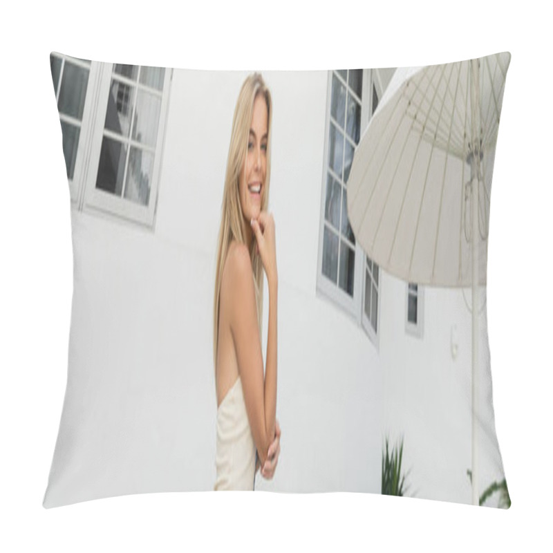 Personality  A Blonde Woman In A White Dress Poses Gracefully In Front Of A Stunning Building In Miami. Pillow Covers