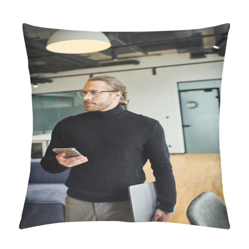 Personality  Serious Businessman In Black Turtleneck And Stylish Eyeglasses Looking Away While Standing With Laptop And Smartphone In Modern Coworking Environment, Successful Business Concept Pillow Covers