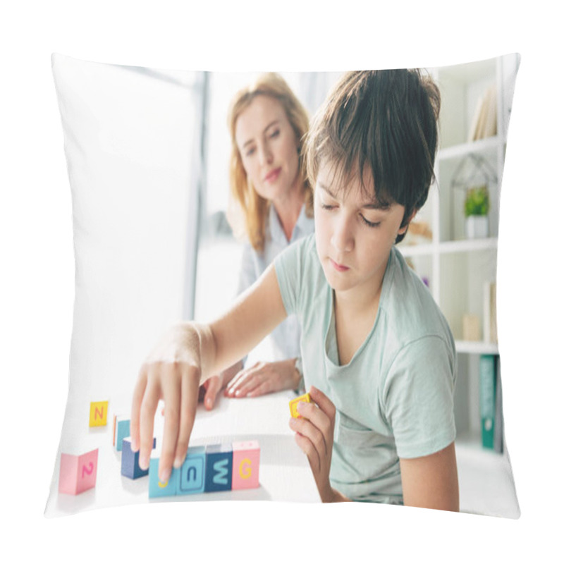 Personality  Selective Focus Of Kid With Dyslexia Playing With Building Blocks And Child Psychologist Looking At It On Background  Pillow Covers