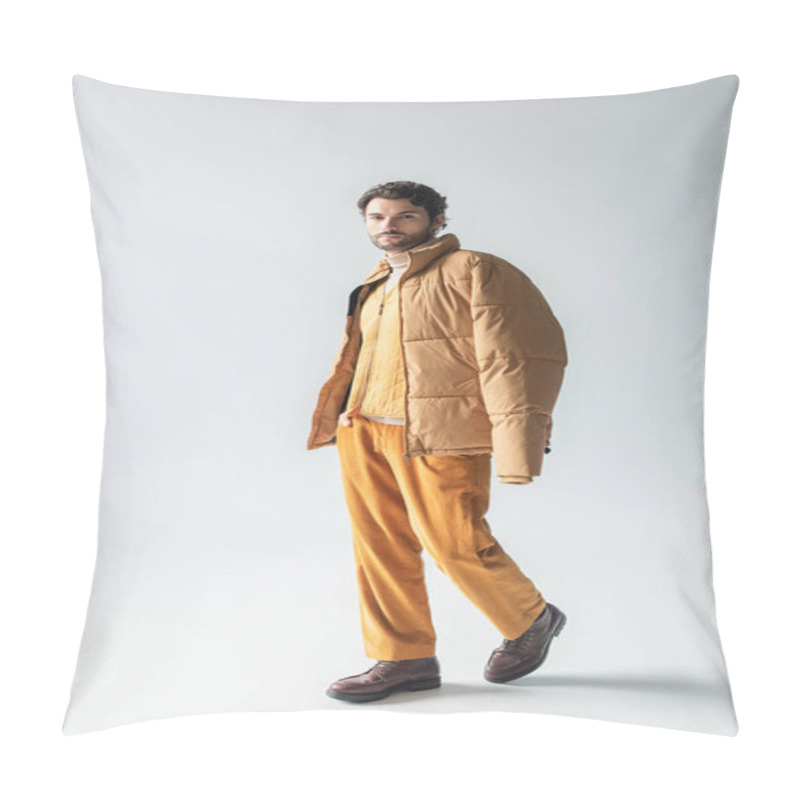 Personality  Full Length View Of Man In Warm Puffer Jacket And Yellow Trousers Posing With Hand In Pocket On Grey Pillow Covers