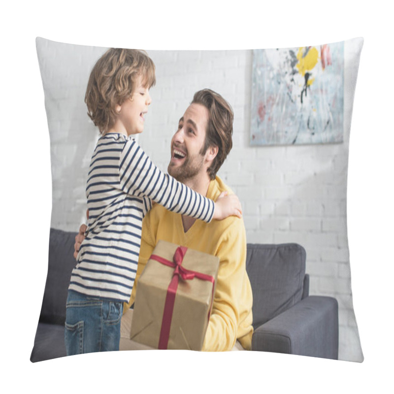 Personality  Cheerful Kid Hugging Father With Present On Blurred Foreground  Pillow Covers