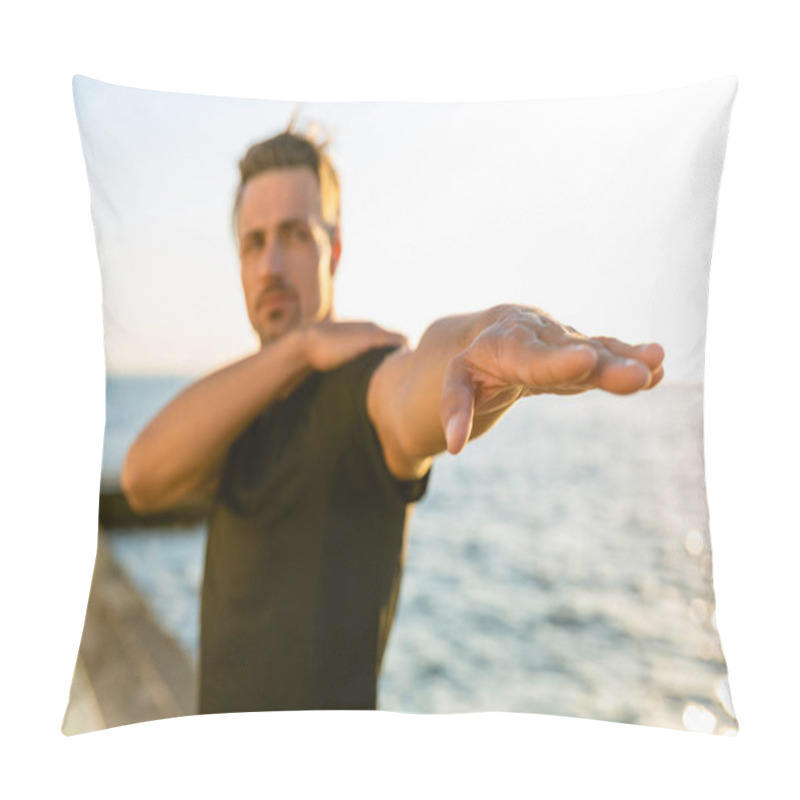 Personality  Close-up Shot Of Adult Sportsman Stretching Arm Before Training On Seashore Pillow Covers