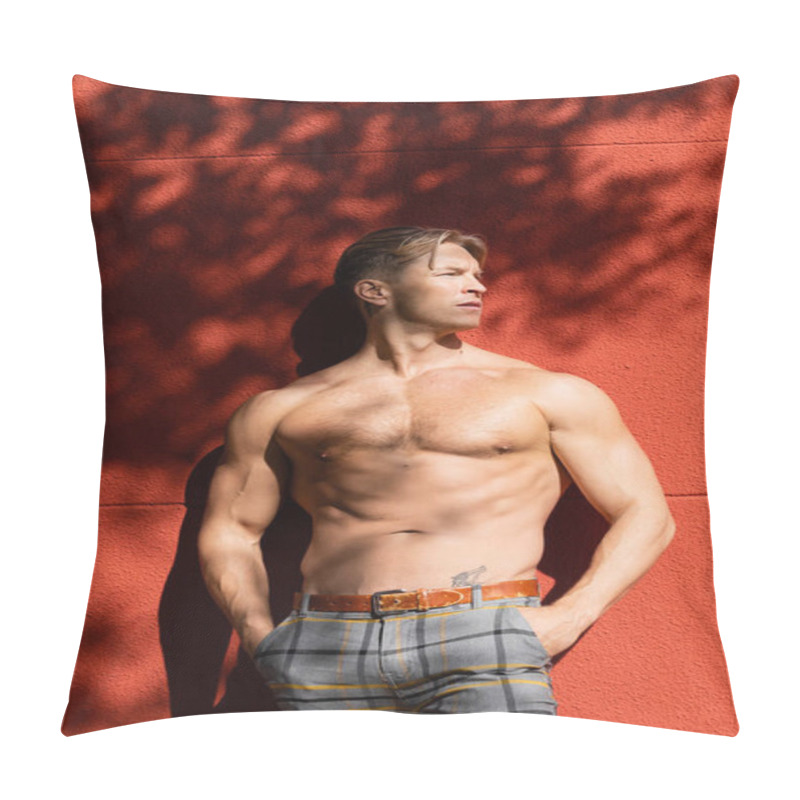 Personality  A Shirtless, Muscular Blonde Man Poses Against A Red Wall, His Hands In His Pockets, While Looking Off To The Side. Pillow Covers