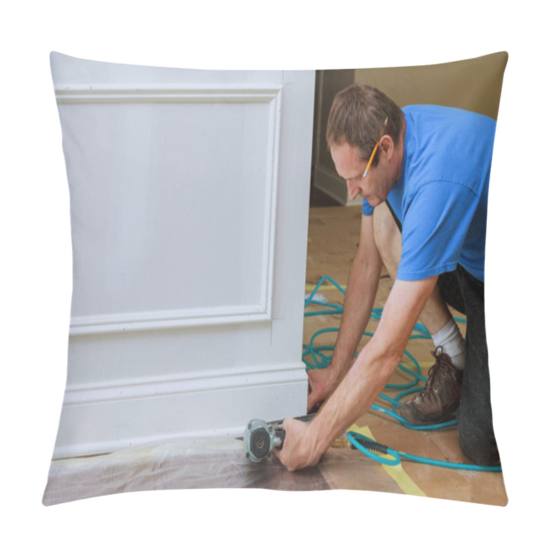 Personality  Carpenter Carefully Fits Baseboard Trim In Room Undergoing Renovation Uses Power Tools Ensures Precise Measurements Pillow Covers