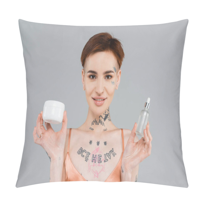 Personality  Young And Tattooed Woman Holding Cosmetic Products While Smiling Isolated On Grey  Pillow Covers