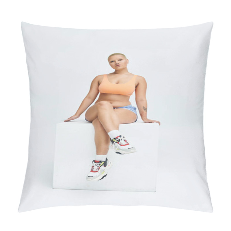 Personality  A Confident Young Woman Showcases Vibrant Fashion While Seated On A Geometric Pedestal. Pillow Covers