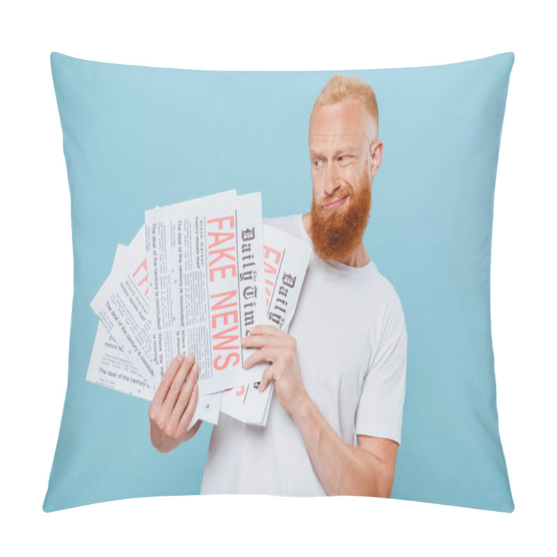 Personality  Skeptical Bearded Man Looking At Newspapers With Fake News, Isolated On Blue Pillow Covers