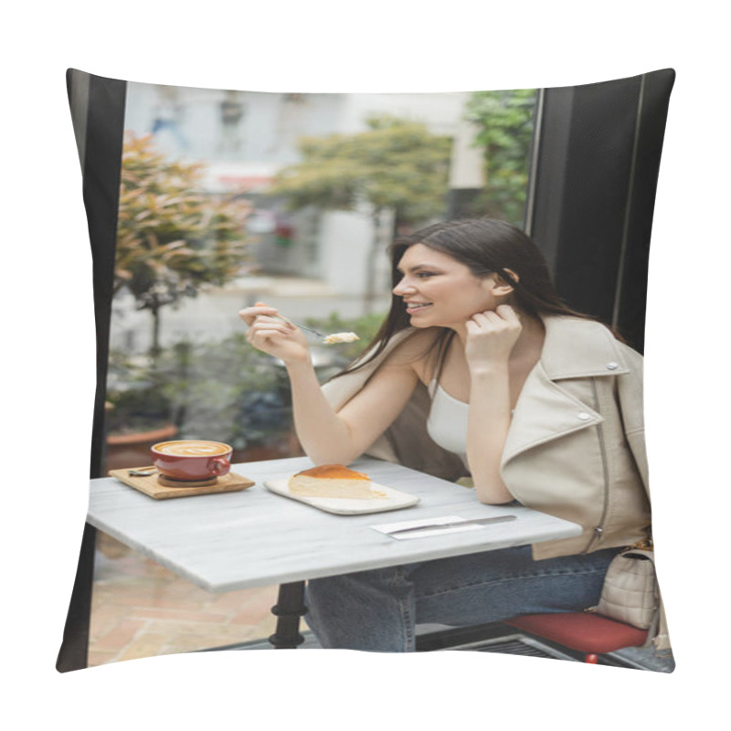 Personality  Cheerful Woman With Long Hair Holding Fork Near Cheesecake Next To Cup Of Cappuccino With Coffee Art On Bistro Table While Sitting In Leather Jacket Near Window Inside Of Modern Cafe In Istanbul  Pillow Covers