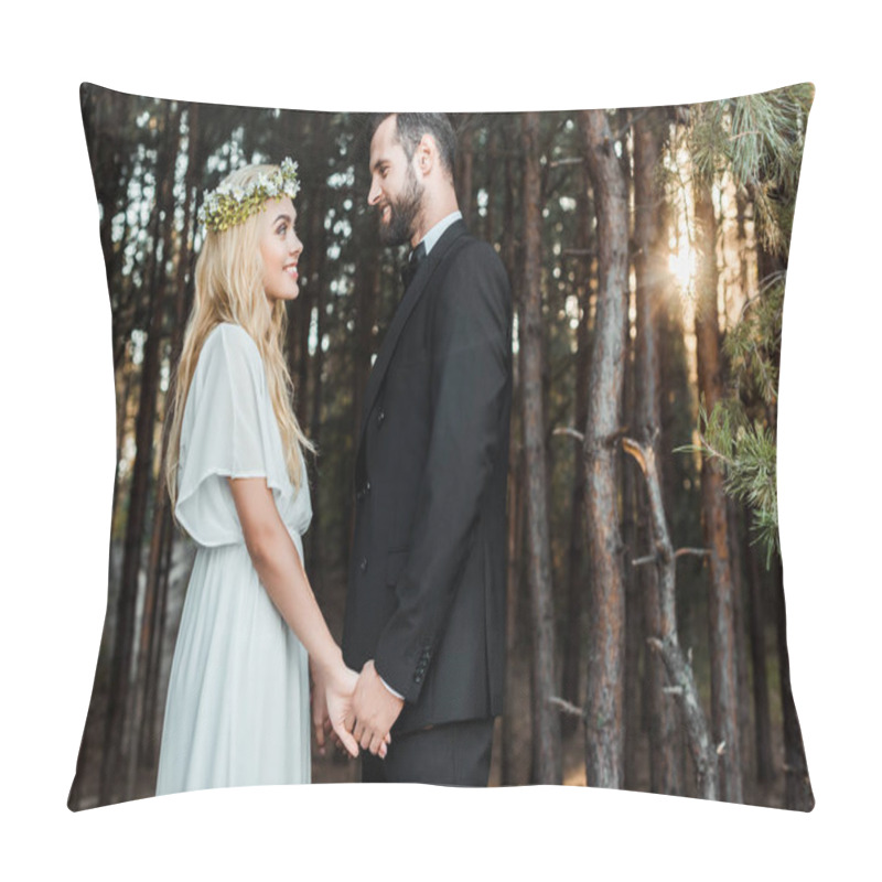 Personality  Side View Of Happy Wedding Couple Holding Hands And Looking At Each Other During Sunset In Forest Pillow Covers