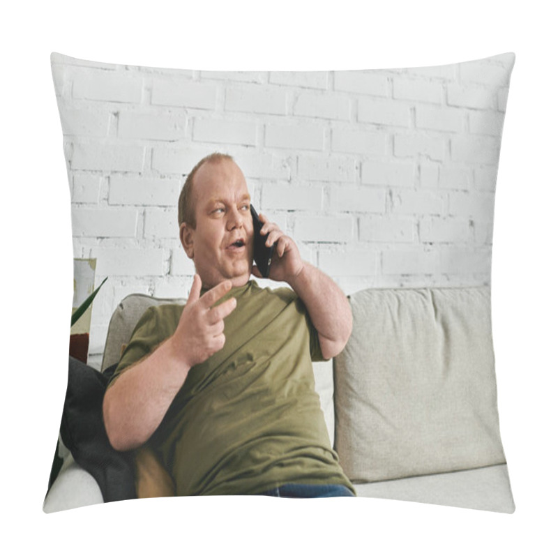 Personality  A Man With Inclusivity In Casual Attire Sits On A Couch, Talking On The Phone, In A Home Setting. Pillow Covers