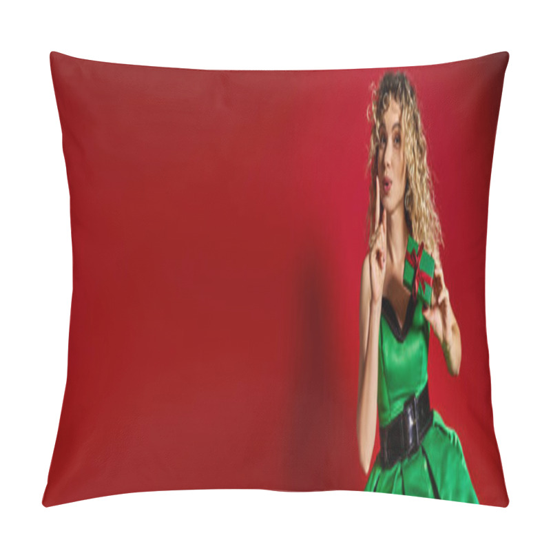 Personality  Pretty New Year Elf In Green Dress Showing Silence Gesture And Holding Gift On Red Backdrop, Banner Pillow Covers