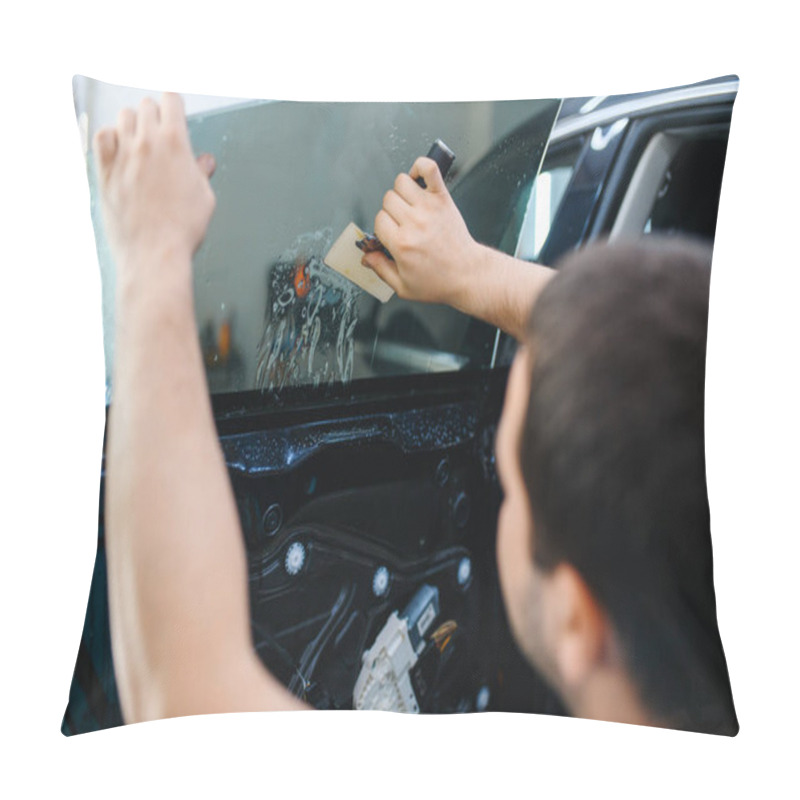 Personality  Male Worker Installs Wetted Car Tinting, Tuning Service. Mechanic Applying Vinyl Tint On Vehicle Window In Garage, Tinted Glass Pillow Covers