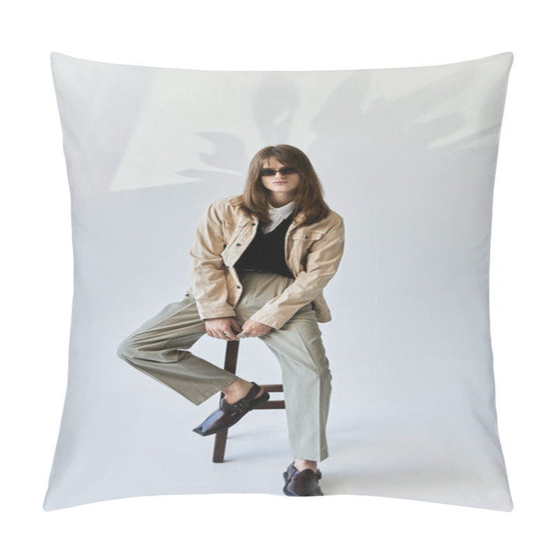 Personality  A Fashionable Young Man Confidently Poses On A Chair, Exuding Modern Style And Charisma. Pillow Covers