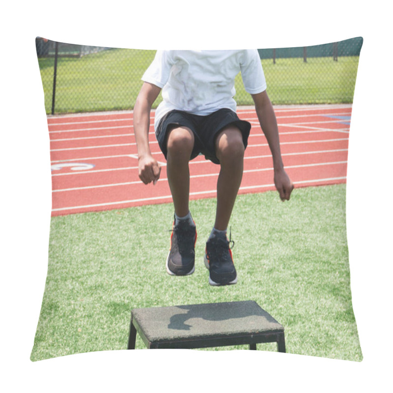 Personality  Front View Of A Young Athlete Jumping Onto A Plyo Box During A High School Summer Sports Camp. Pillow Covers