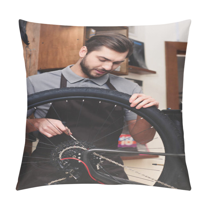 Personality  Young Worker In Apron Holding Bicycle Wheel And Fixing Chain In Workshop Pillow Covers