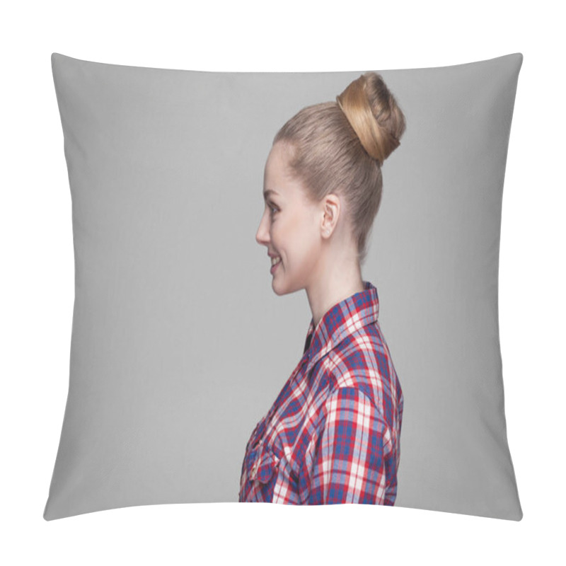 Personality  Side View Of Beautiful Blonde Woman In Checkered Shirt With Collected Bun Hairstyle Standing And Looking Aside With Toothy Smile On Gray Background Pillow Covers