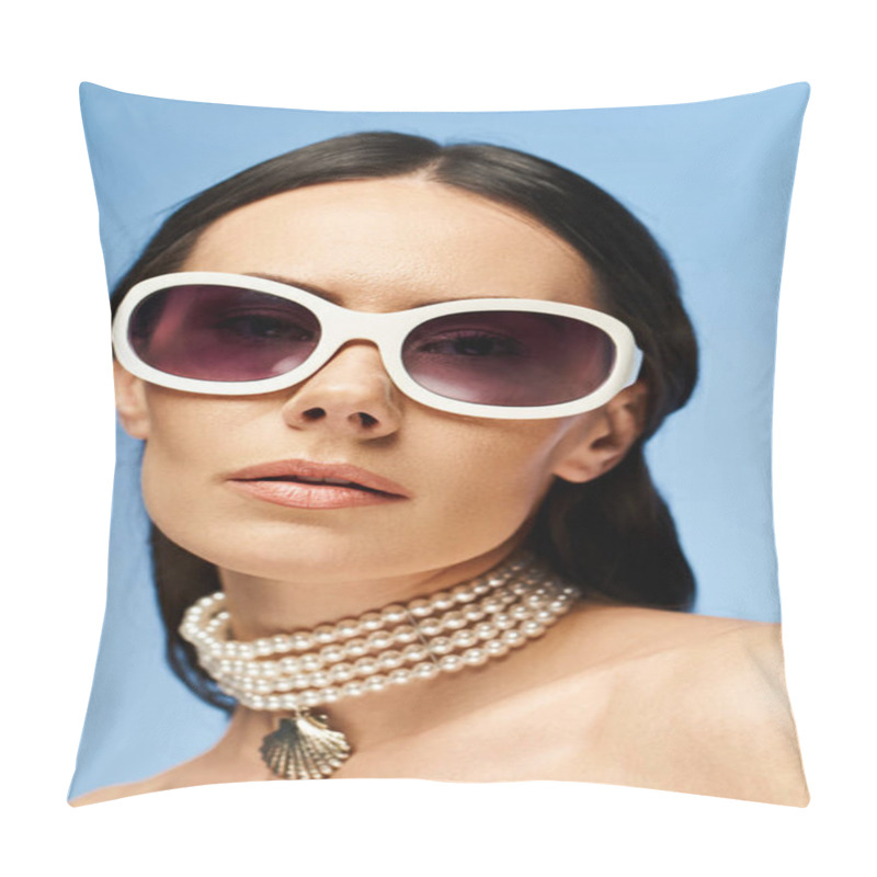 Personality  A Stylish Woman Wearing Sunglasses And A Pearl Necklace Poses In A Studio Against A Blue Background, Exuding A Glamorous Summer Vibe. Pillow Covers