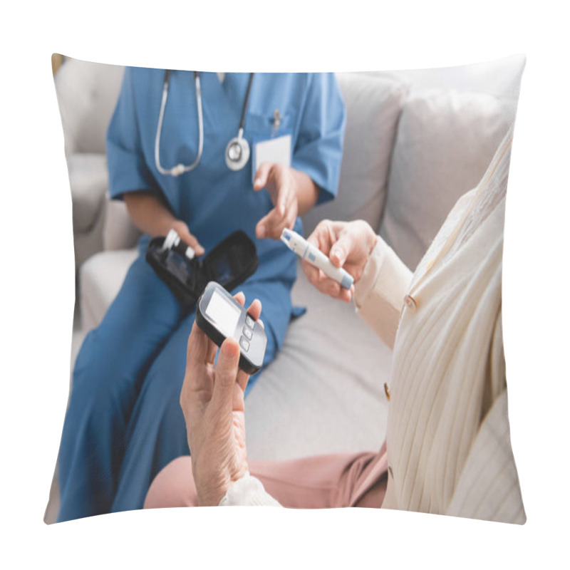 Personality  Cropped View Of Senior Woman Holding Lancet Pen And Glucometer Near Multiracial Nurse Sitting On Sofa  Pillow Covers