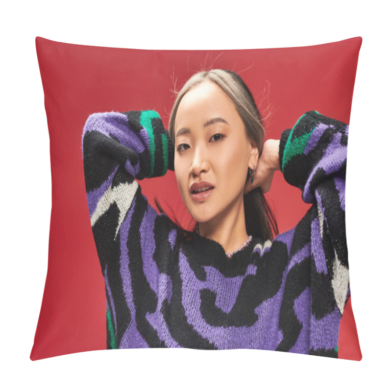 Personality  Pretty And Young Asian Woman With Dyed Hair In Vibrant Sweater With Animal Print Posing On Red Pillow Covers