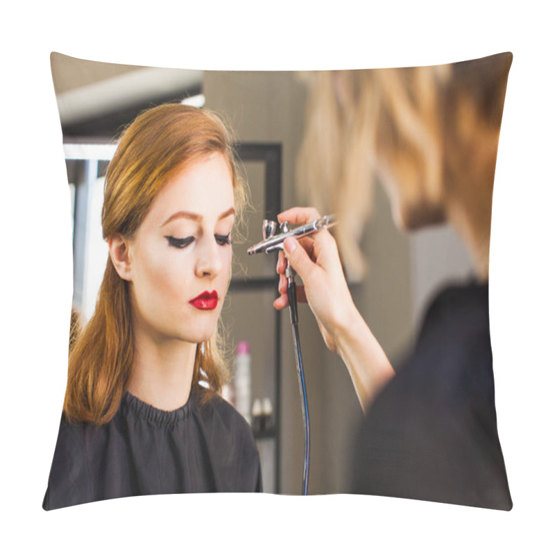 Personality  Visagiste Making The Girl Professional Makeup Using An Airbrush. Pillow Covers