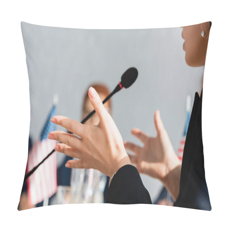 Personality  Cropped View Of Female Politician Gesturing, While Speaking In Microphone With Blurred Woman On Background Pillow Covers