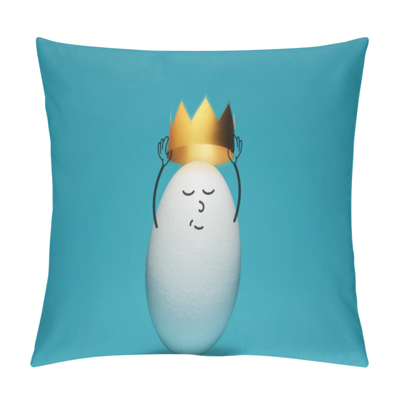 Personality  A White Egg Is Dressing A Gold Crown On Blue Background. Concept Of Success. Pillow Covers