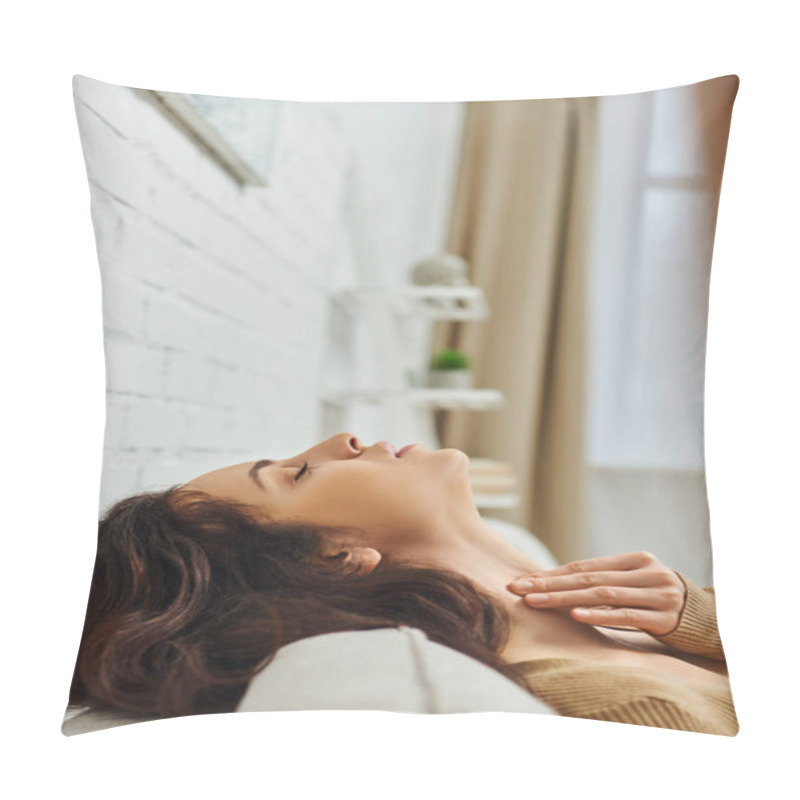 Personality  Side View Of Young Brunette Woman In Brown Jumper Massaging Thyroid Gland And Neck While Relaxing And Sitting On Couch At Home, Self-care Ritual And Holistic Healing Concept, Tension Relief Pillow Covers