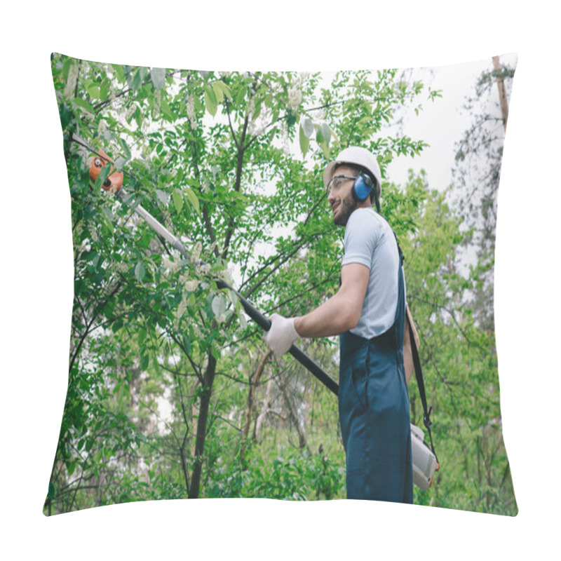 Personality  Smiling Gardener In Overalls And Hearing Protectors Trimming Trees With Telescopic Pole Saw In Park Pillow Covers