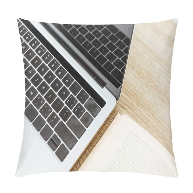 Personality  Close-up Shot Of Laptop With Opened Book On Wooden Surface Pillow Covers