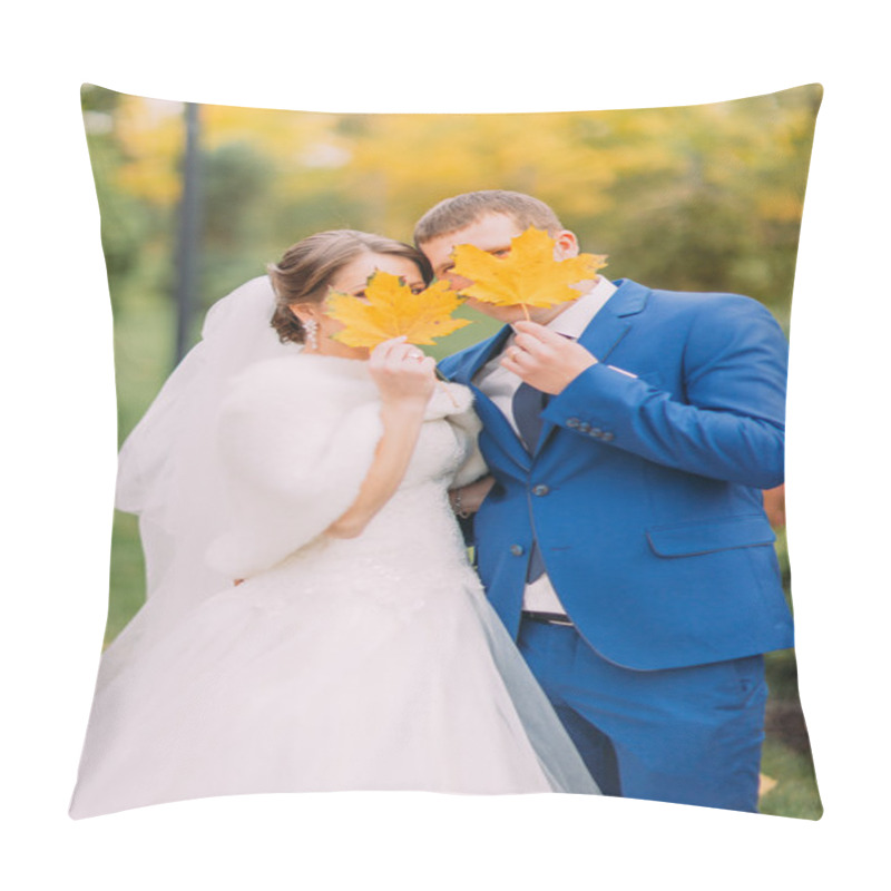 Personality  Newly Married Couple Posing Outdoors. Young People Hiding Their Faces Behind Autumn Leaves Pillow Covers