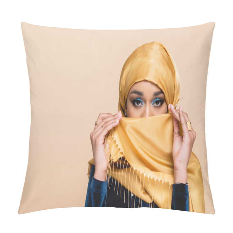 Personality  Muslim Woman With Bright Eye Makeup Covering Face With Hijab Isolated On Beige Pillow Covers