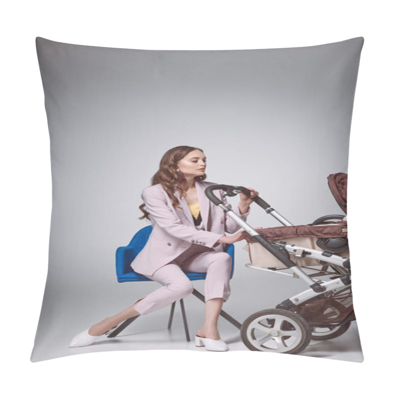 Personality  Beautiful Fashionable Woman Sitting On Chair And Looking At Baby Carriage On Grey Pillow Covers