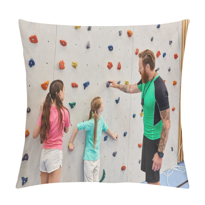 Personality  A Man Teacher Instructs Two Young Girls In Front Of A Climbing Wall In A Bright, Lively Classroom Setting. Pillow Covers