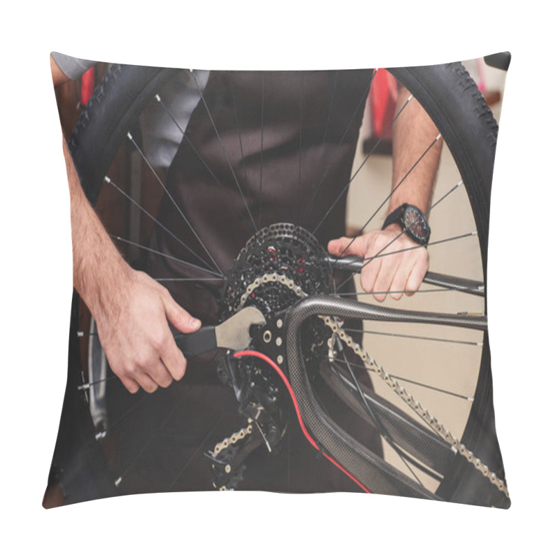 Personality  Cropped Shot Of Man In Apron Fixing Bicycle Wheel And Chain With Wrench Pillow Covers