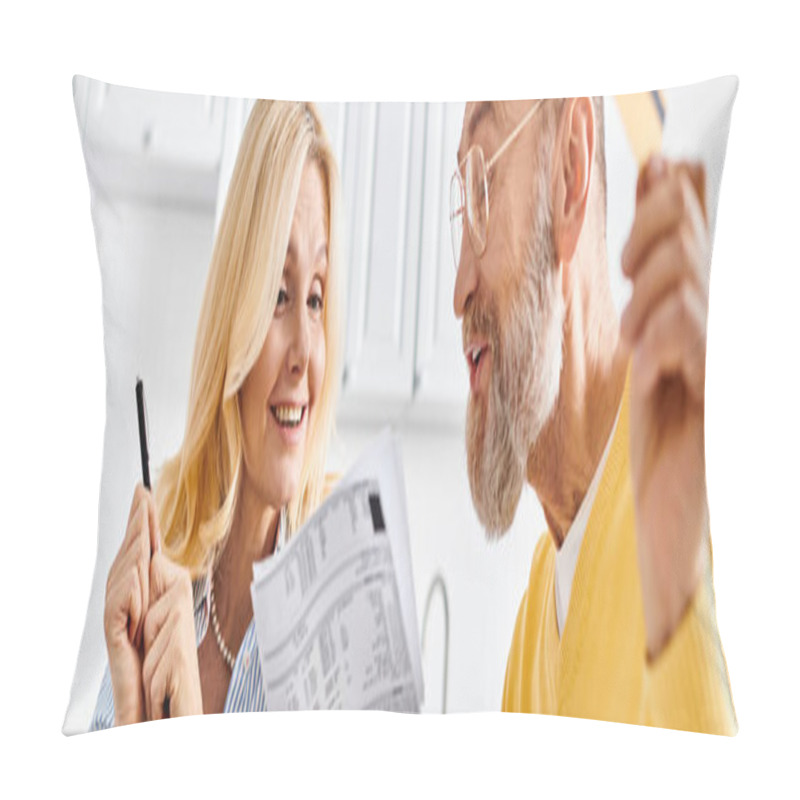 Personality  Mature Couple In Cozy Homewear Sharing A Quiet Moment Together, Focused On Reading The Daily News In A Newspaper. Pillow Covers