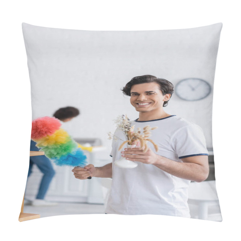 Personality  Happy Young Man Cleaning Wooden Shelf With Dust Brush And Holding Plants In Vase Pillow Covers