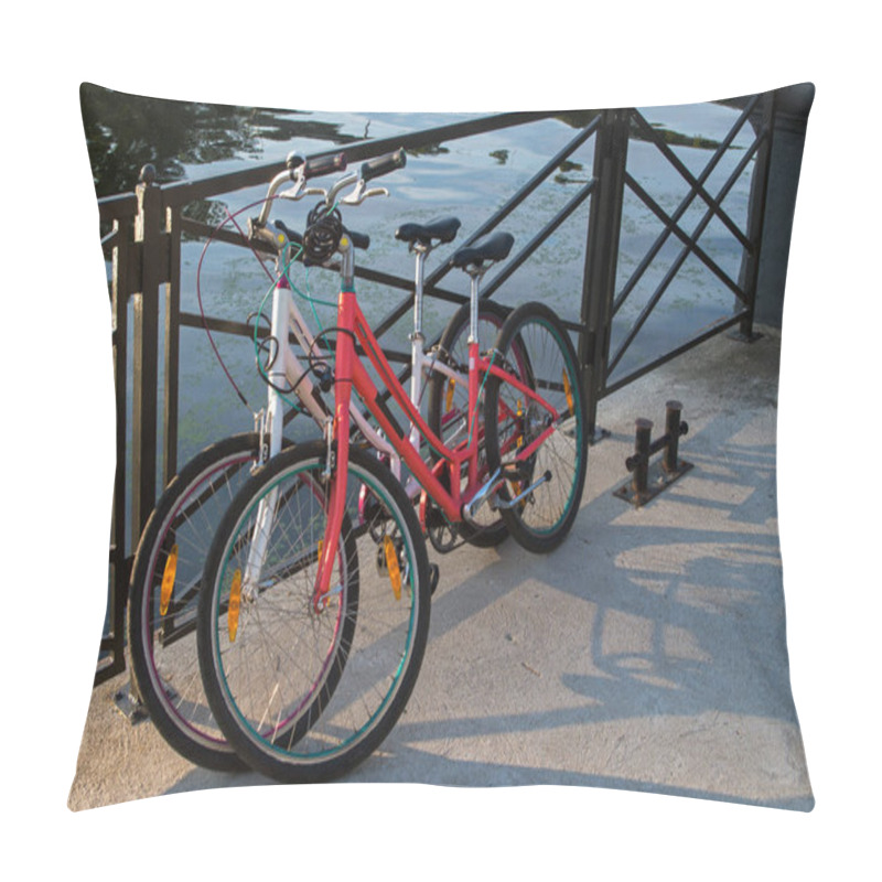 Personality  In The Morning Two Bikes White And Red Of Travelling Together Persons Parked And Locked With Anti-theft Cables To The Fence Street On The Background Of Azure Water In The River Pillow Covers