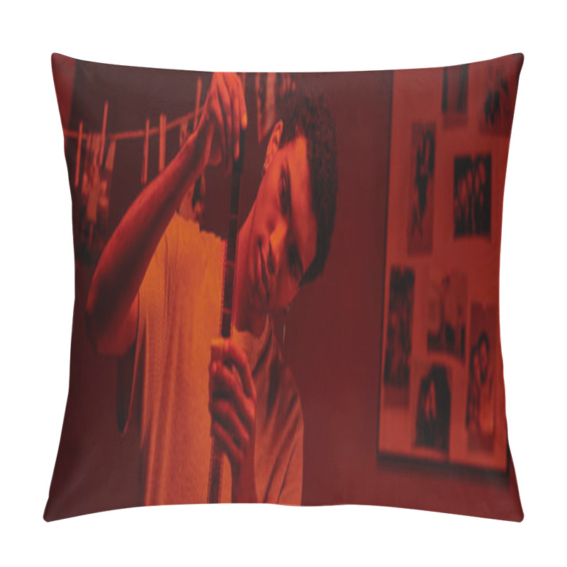 Personality  Focused African American Photographer Examines Developed Film Strip, Bathed In Red Darkroom, Banner Pillow Covers