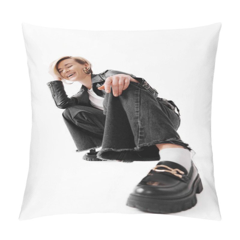 Personality  Full Body Of Young Female In Leather Jacket And Boots Sitting On Haunches On Floor While Hand Touching Hair Against White Background Pillow Covers