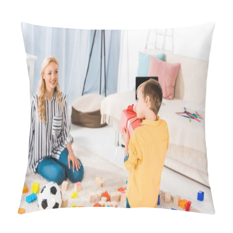 Personality  Selective Focus Of Smiling Mother Looking At Little Boy With Present In Hands Pillow Covers